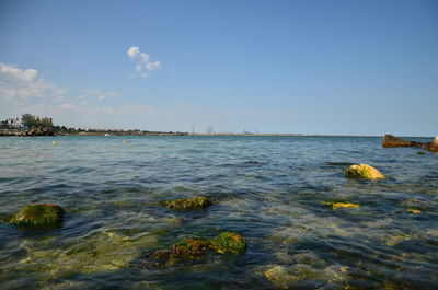 Scenic view of sea against blue sky