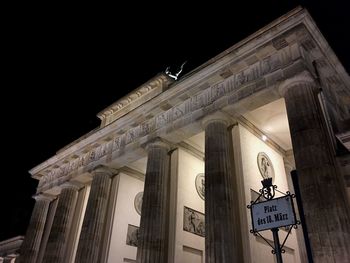 Low angle view of statue at night