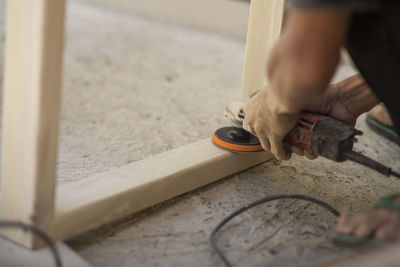 Low section of man working in workshop