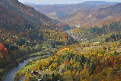 High angle view of river by mountains during autumn