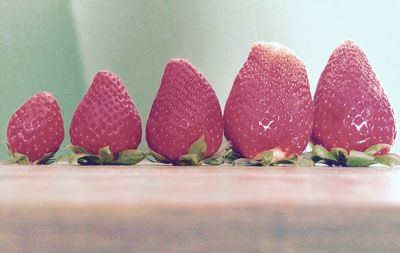 Close-up of strawberries arranged on table