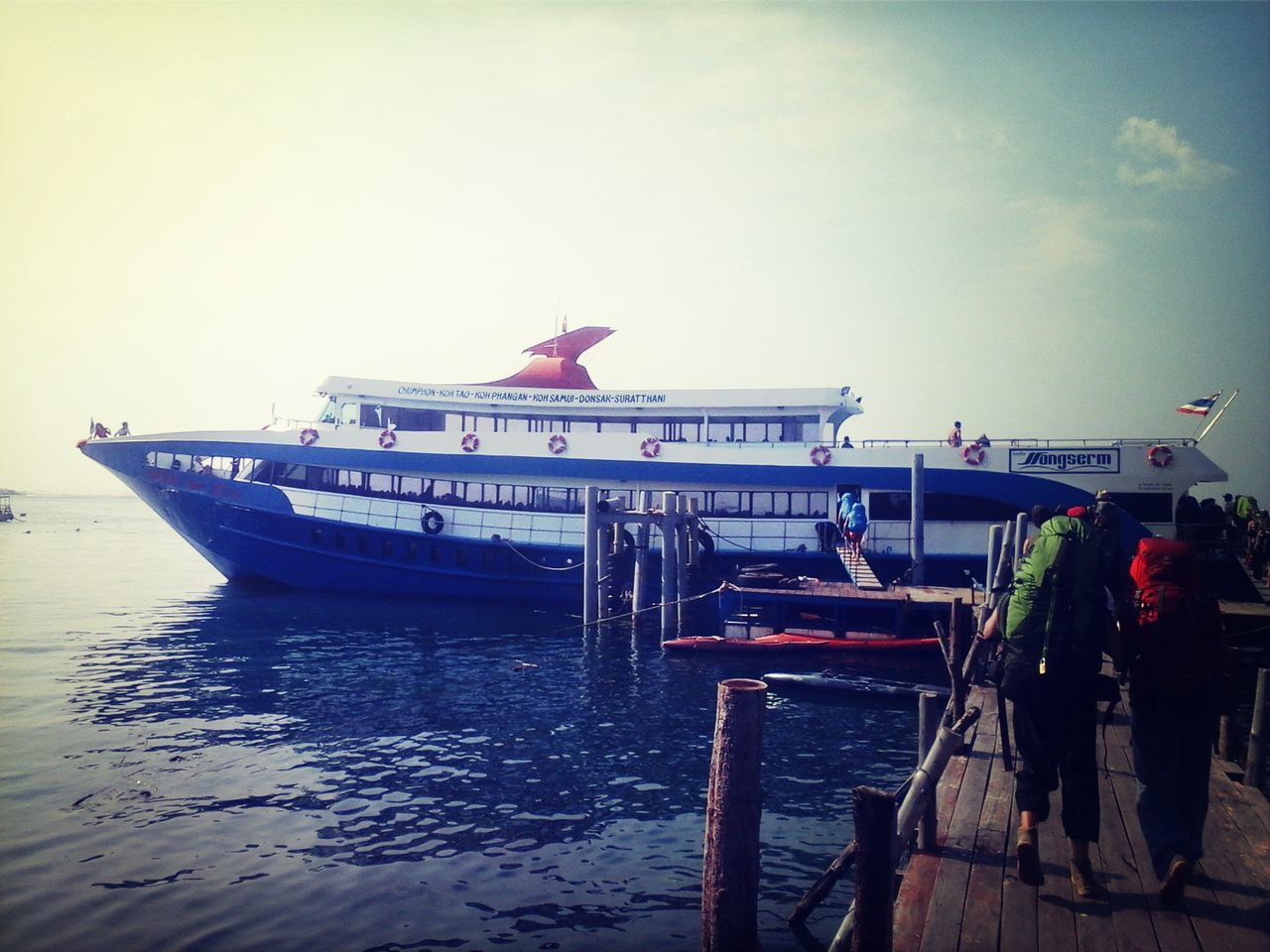 nautical vessel, water, transportation, boat, mode of transport, moored, men, sea, sky, pier, travel, waterfront, lifestyles, day, person, outdoors, clear sky, built structure, leisure activity