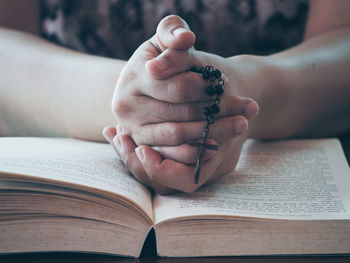 Close-up of woman hand holding book