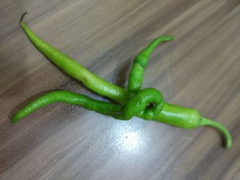 Close-up of green chili pepper on table