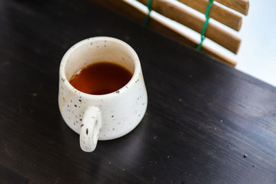 High angle view of coffee cup on table