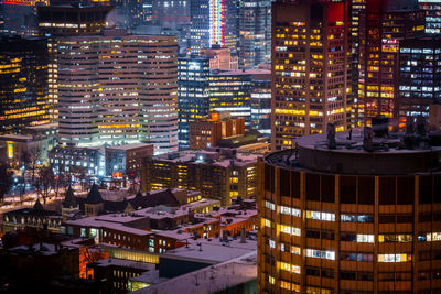 Illuminated buildings in city at night