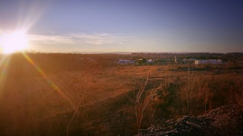 Panoramic view of illuminated landscape against sky