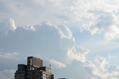 High section of building against cloudy sky