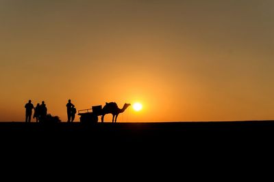 Group of people at sunset in india