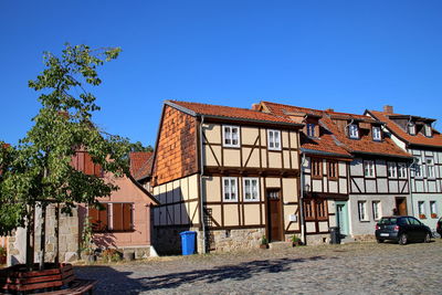 Built structures against clear blue sky