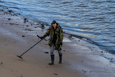 Full length of woman standing on beach