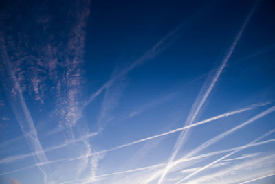 Low angle view of vapor trails in sky