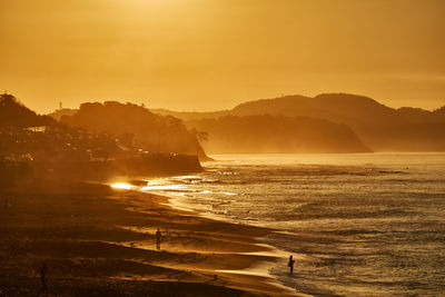 Scenic view of sea against sky during sunrise