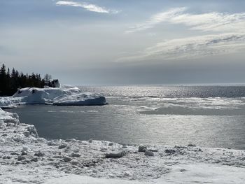 Scenic view of sea against sky during winter