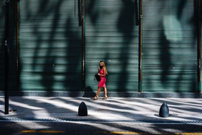 Woman with shadow on wall