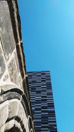 Low angle view of building against clear blue sky