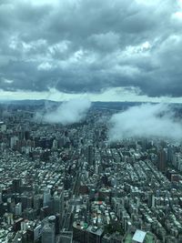 High angle view of modern buildings in city against sky