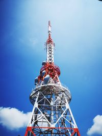 Low angle view of communications tower against sky