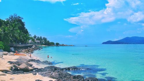 Scenic view of sea against cloudy sky