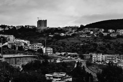 High angle view of buildings in city against sky