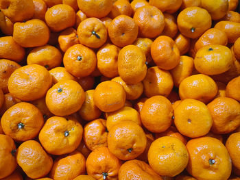 Full frame background of pile of orange fruits