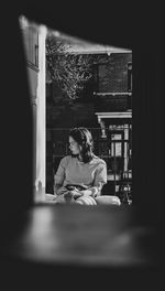 Woman sitting on table