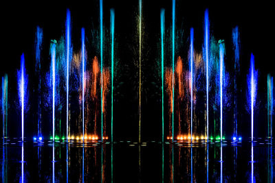 Reflection of illuminated lights on water at night