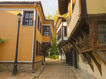 Alley amidst buildings in city