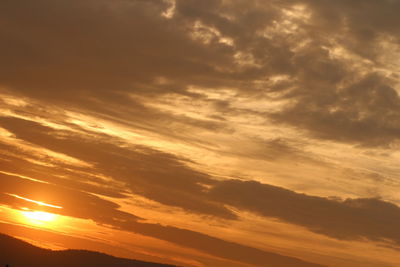 Scenic view of dramatic sky during sunset