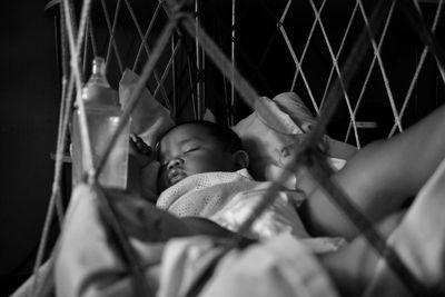 Baby boy sleeping in crib