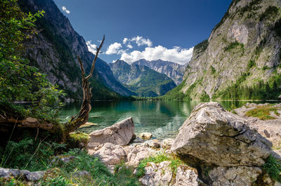 Scenic view of lake and mountains against sky