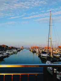 Boats moored at harbor