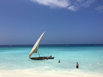 Sailboat on sea against sky