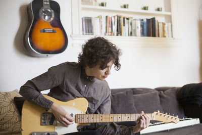 Young woman playing a guitar