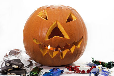 Close-up of pumpkin against orange background