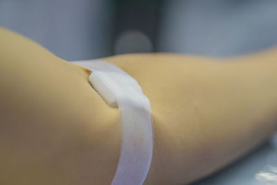 Cropped image of person hand with bandage