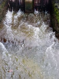 High angle view of water flowing in sea