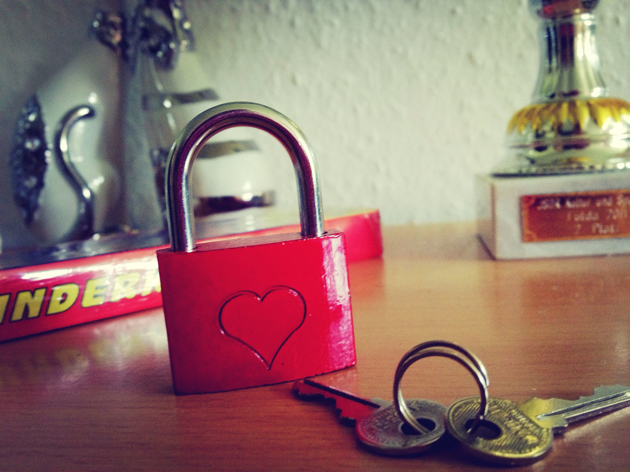 indoors, close-up, still life, table, metal, red, old-fashioned, wall - building feature, no people, focus on foreground, door, art and craft, home interior, art, toy, retro styled, window, reflection, day, creativity