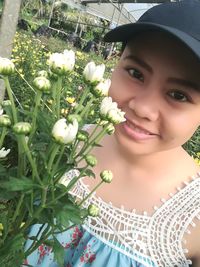 Portrait of smiling girl with flowers