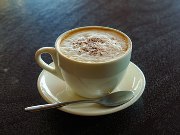 Close-up of coffee cup on table