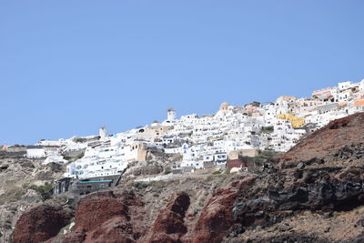 Low angle view of buildings against clear sky