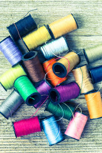 Close-up of colorful spools on table