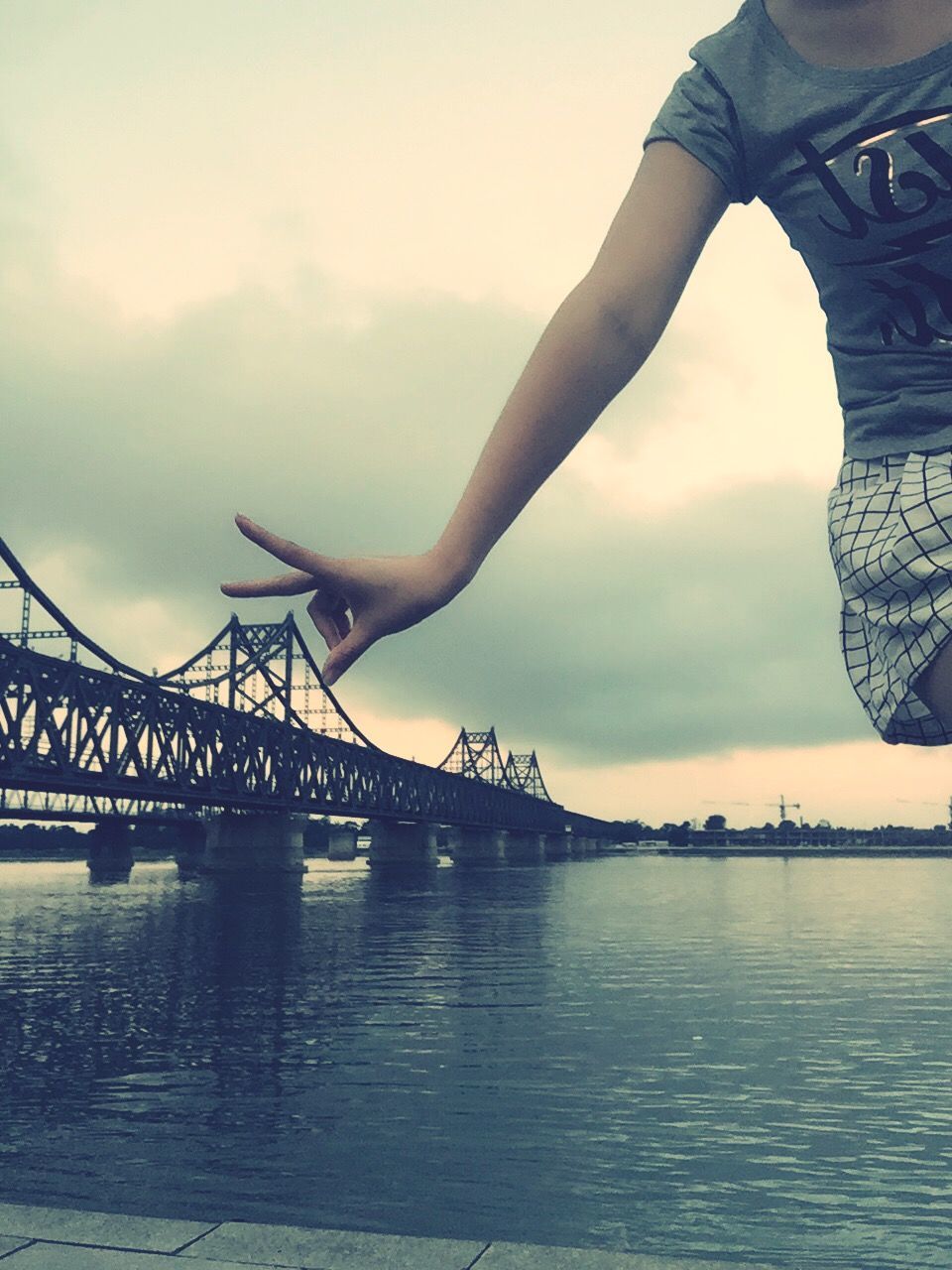 sky, water, cloud - sky, built structure, architecture, waterfront, river, bridge - man made structure, cloudy, cloud, connection, outdoors, travel destinations, low angle view, dusk, silhouette, day, nature