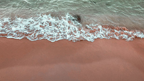 High angle view of surf on beach