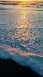 Scenic view of sea against sky at sunset