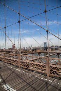 Bridge over sea against sky in city