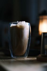 Ice coffee on wood table in morning with latte coffee