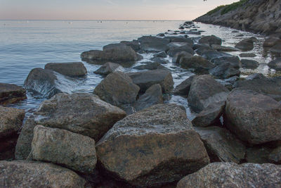 Scenic view of sea against sky at sunset