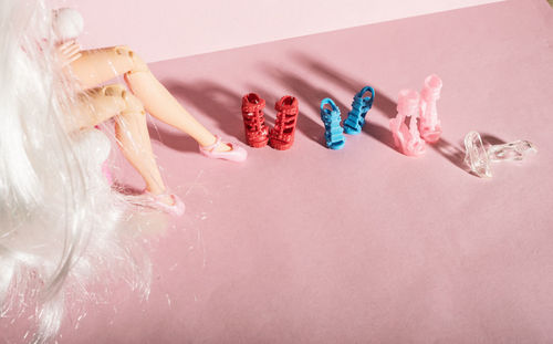 High angle view of hand on pink cake