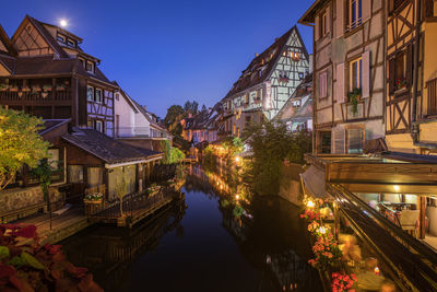 Canal amidst buildings in city